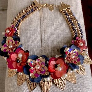 Statement necklace. Pairs great with white, navy, pink or neutral tones.